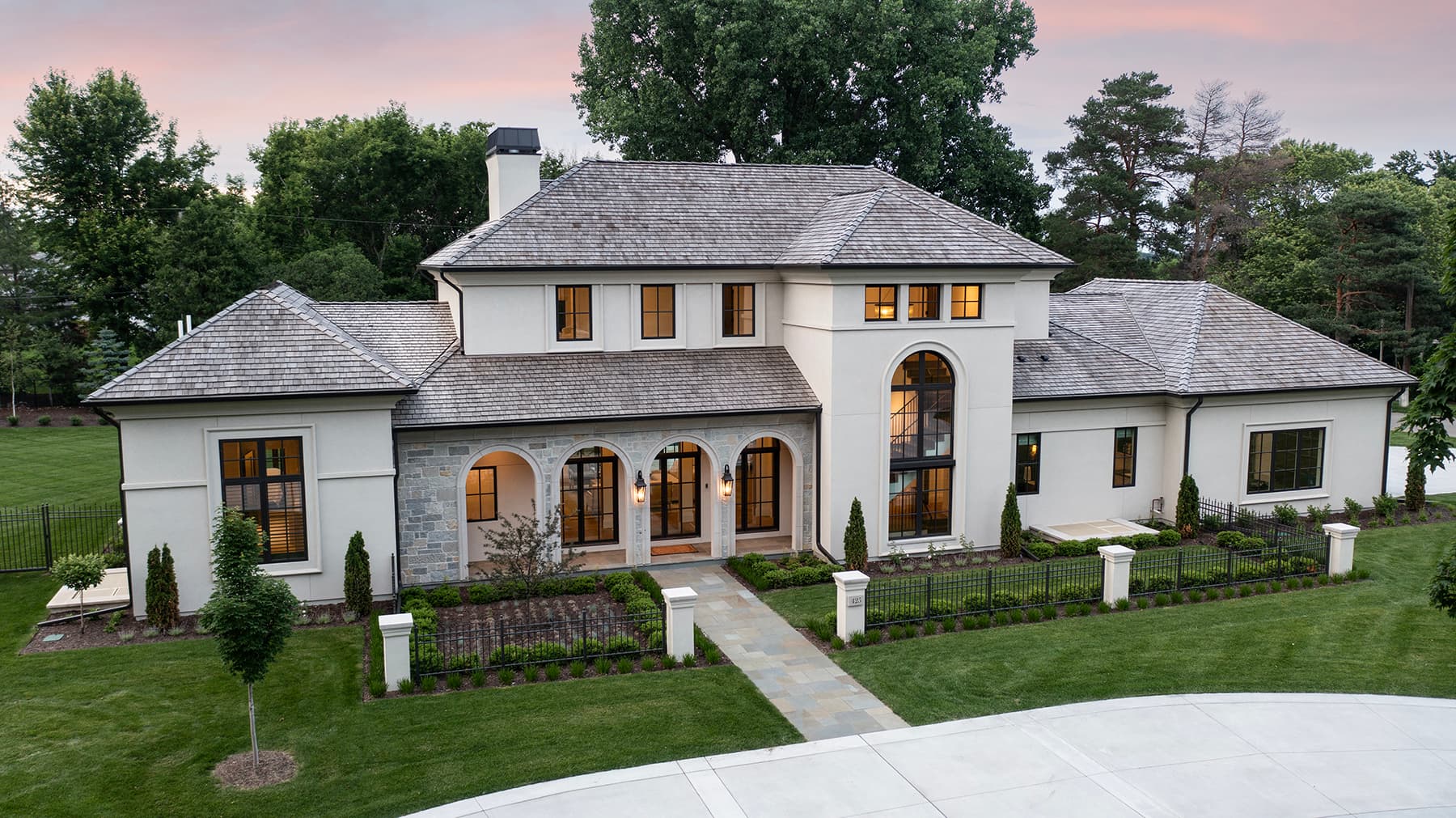 Elevated view of Highcroft's formal entrance garden and arched facade