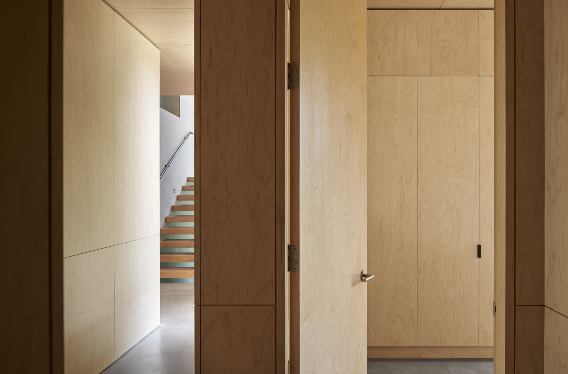 River’s Edge warm wood interior and staircase