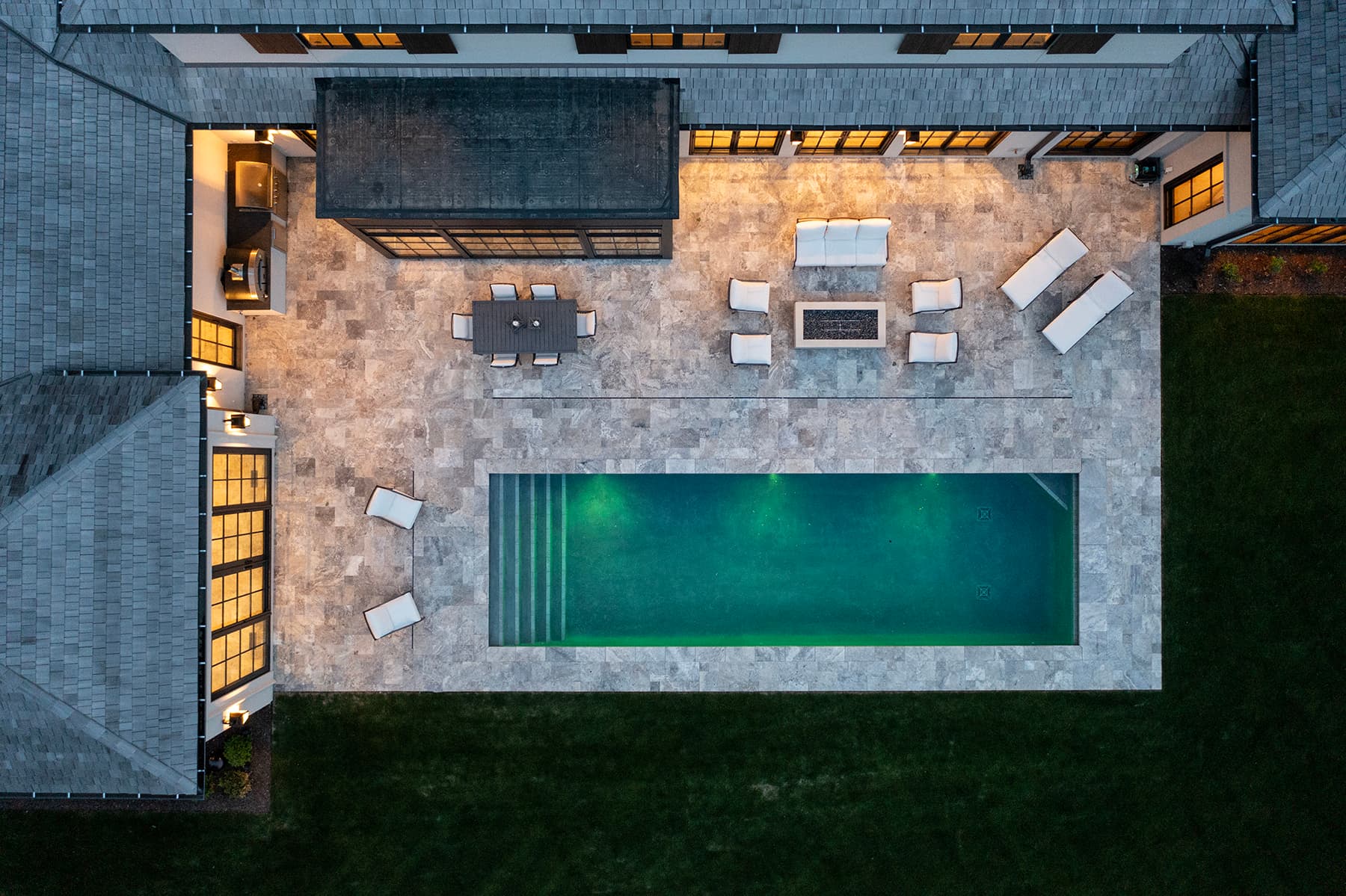 Overhead view of Highcroft's pool terrace, fire table and outdoor kitchen