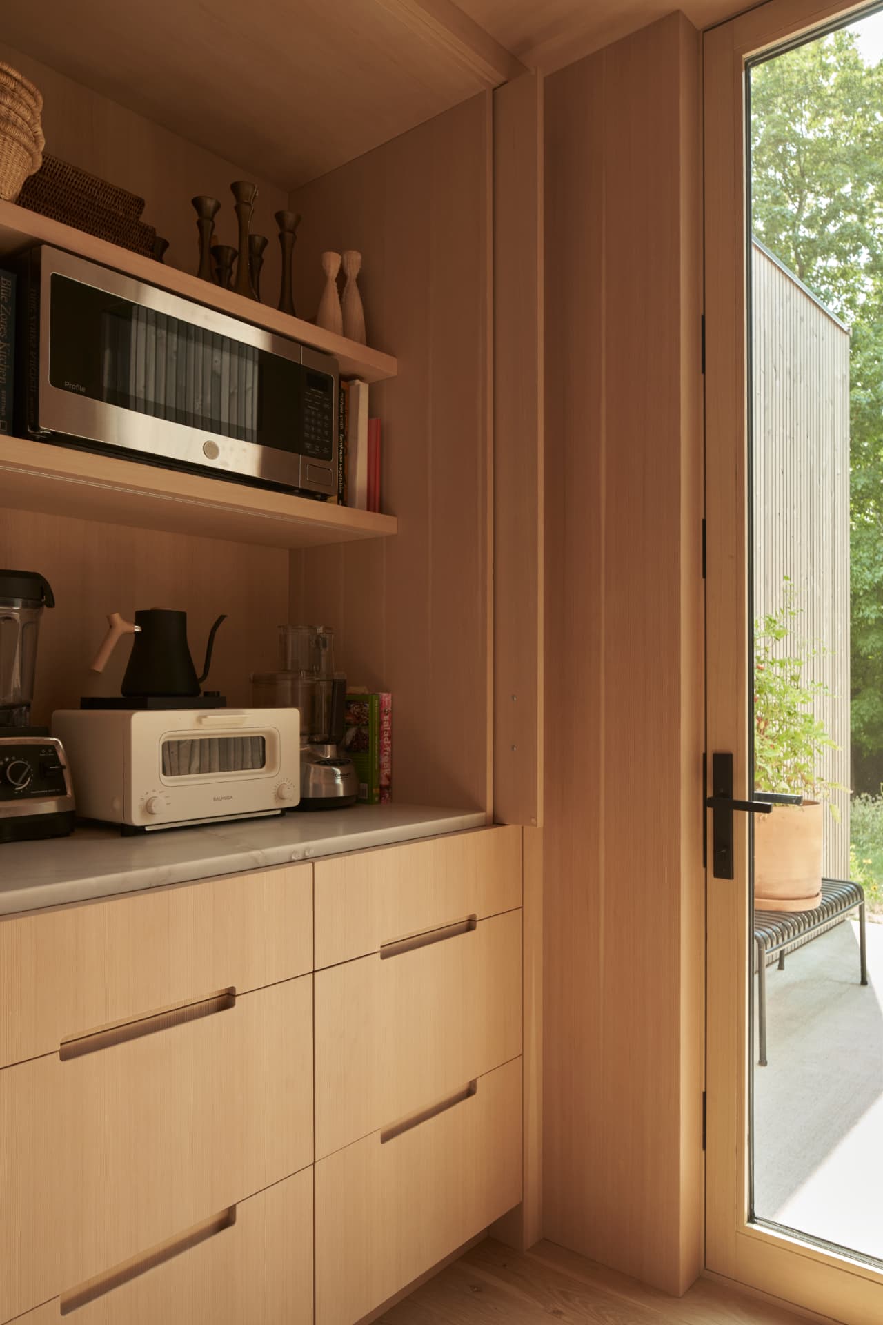 Hill House open cabinet with kitchen tools and small appliances