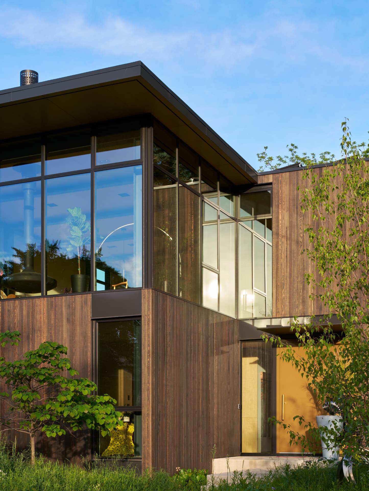 River’s Edge entry and glass-walled living space