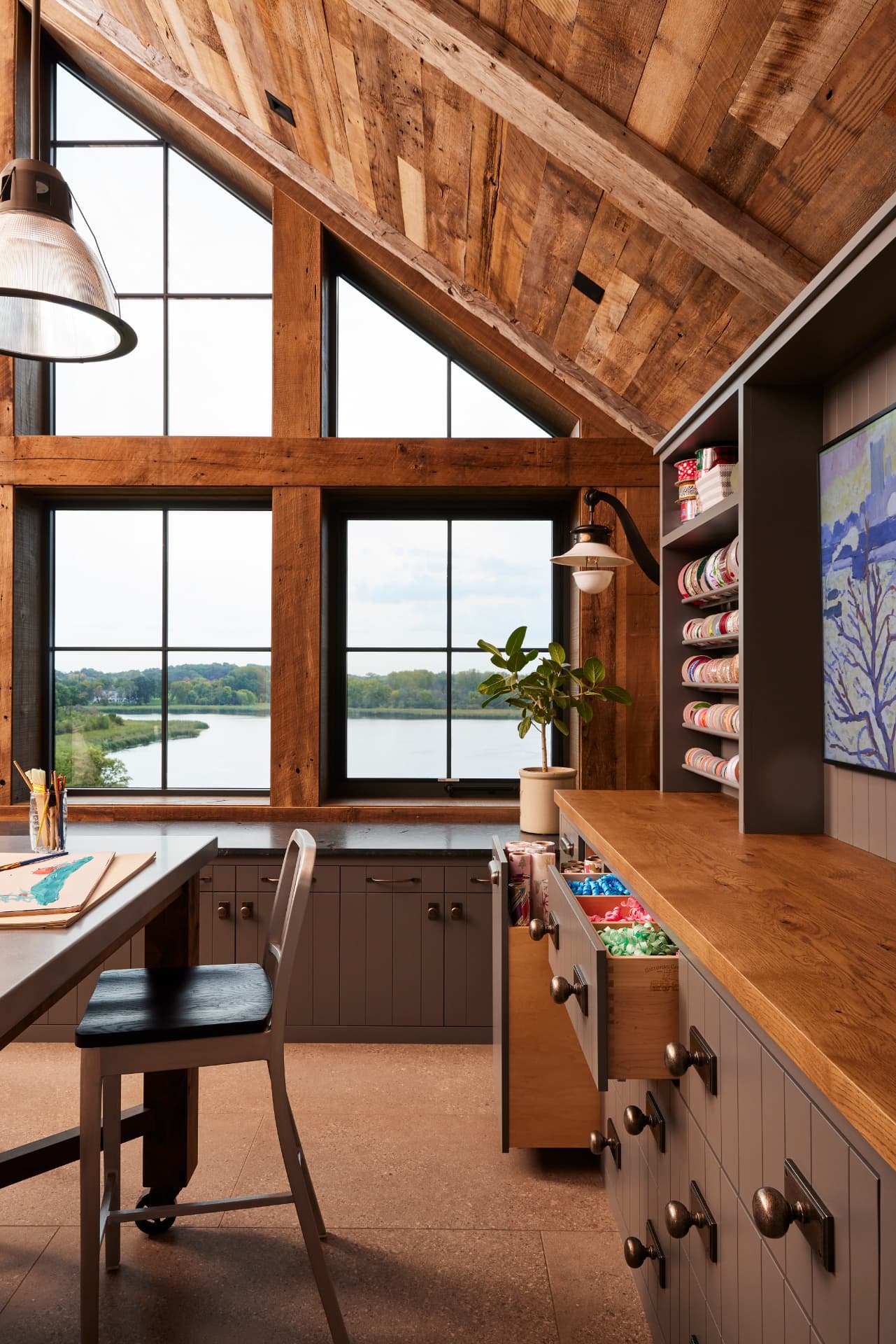Timber Retreat upper loft with barn view through gabled windows