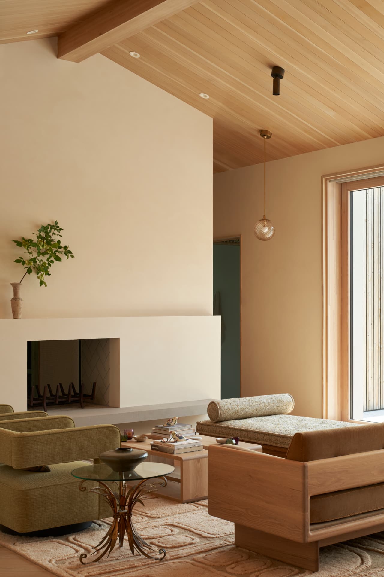 Hill House living room with a sculptural plaster fireplace