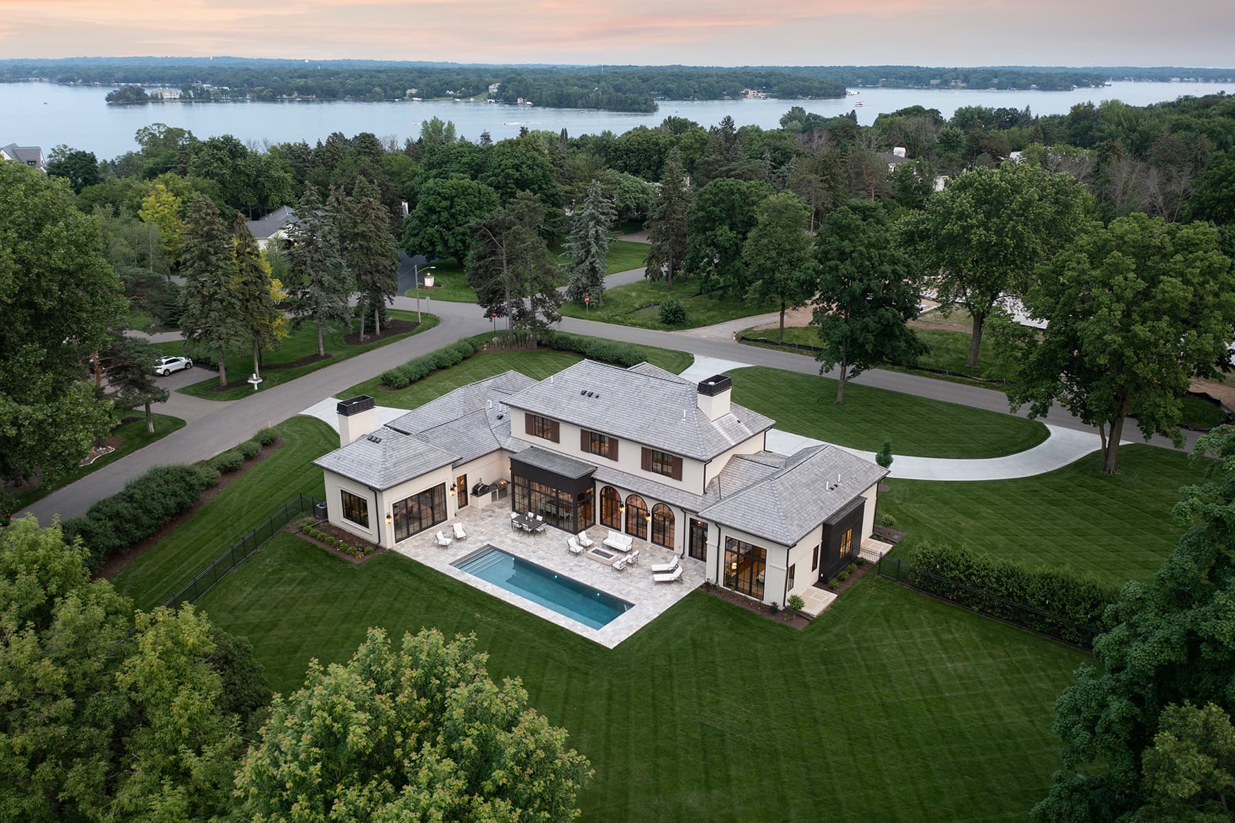 Aerial of Highcroft with Lake Minnetonka beyond at sunset