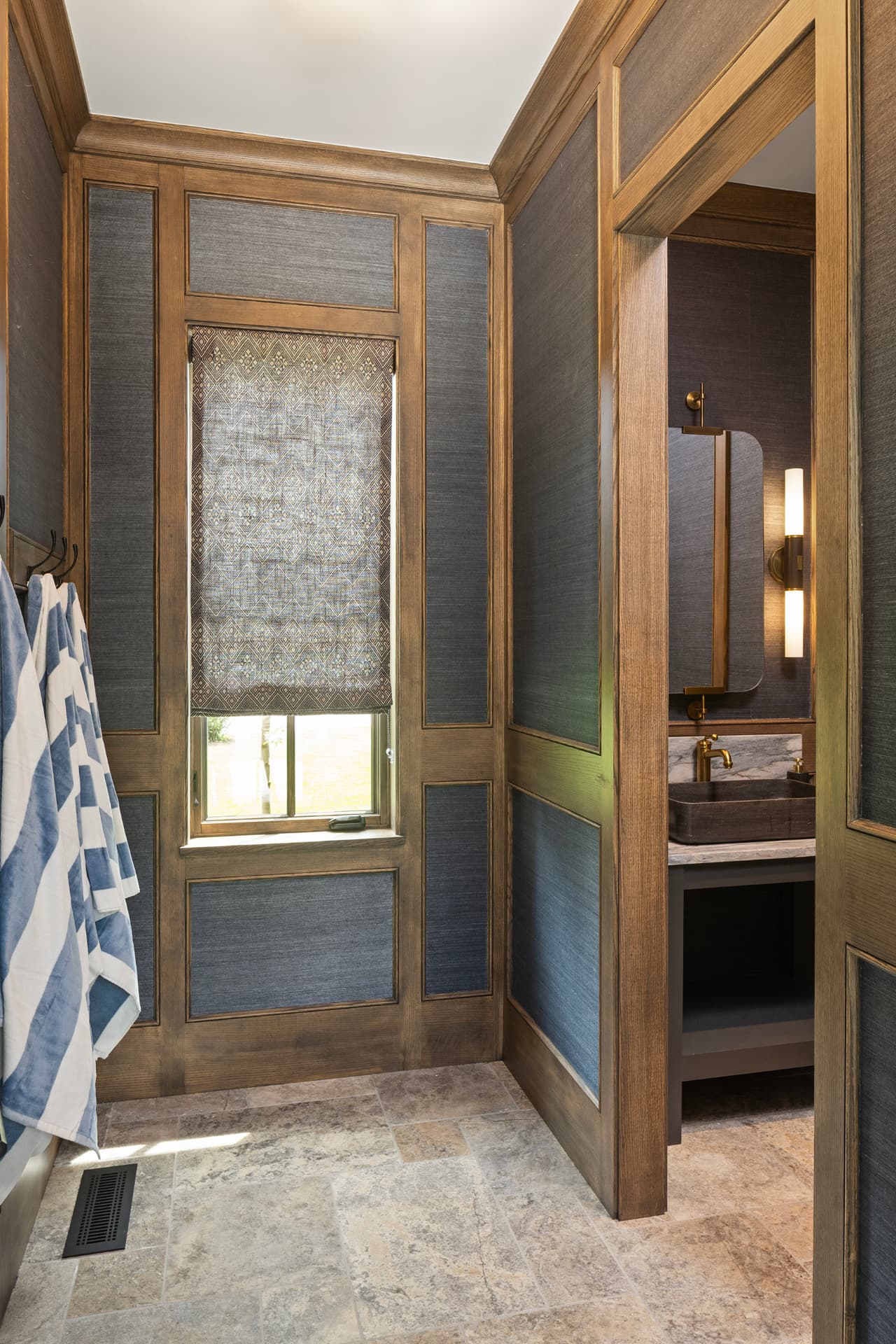 Highcroft pool changing room in stained oak paneling and grasscloth