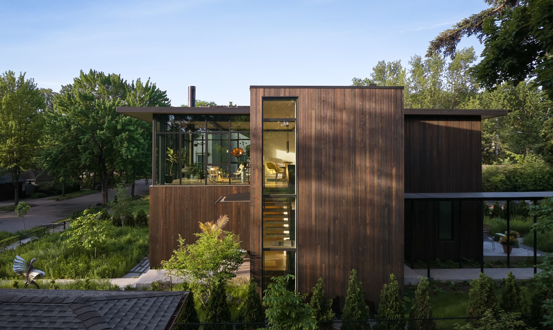 River’s Edge wood-clad exterior and glass stairwell