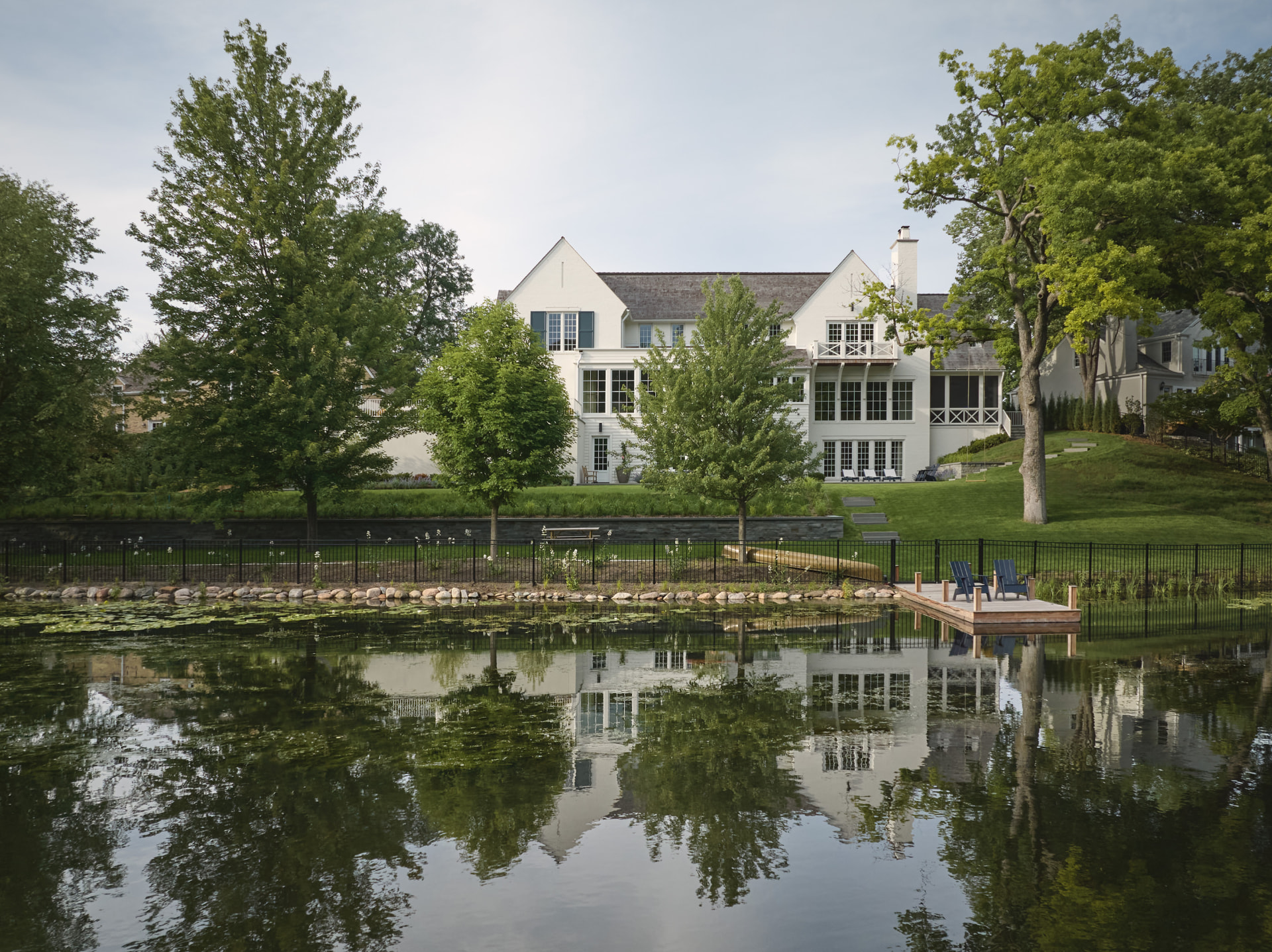 Waters Edge residence reflected in the pond