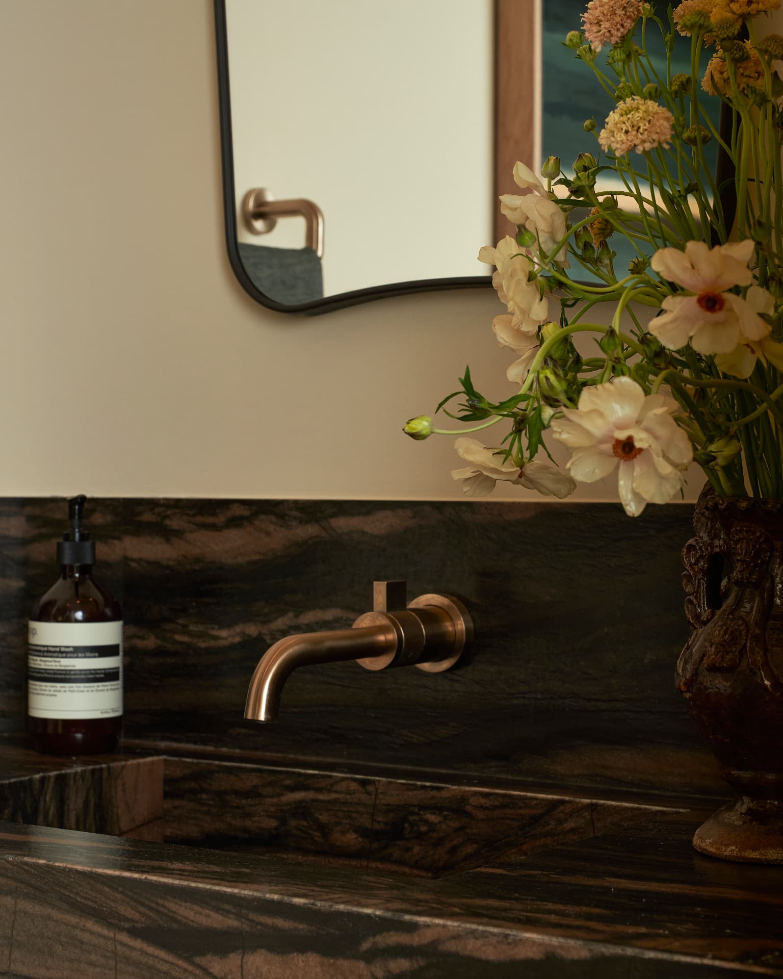 Hill House powder room detail with hand-painted pattern and ceramic fixture