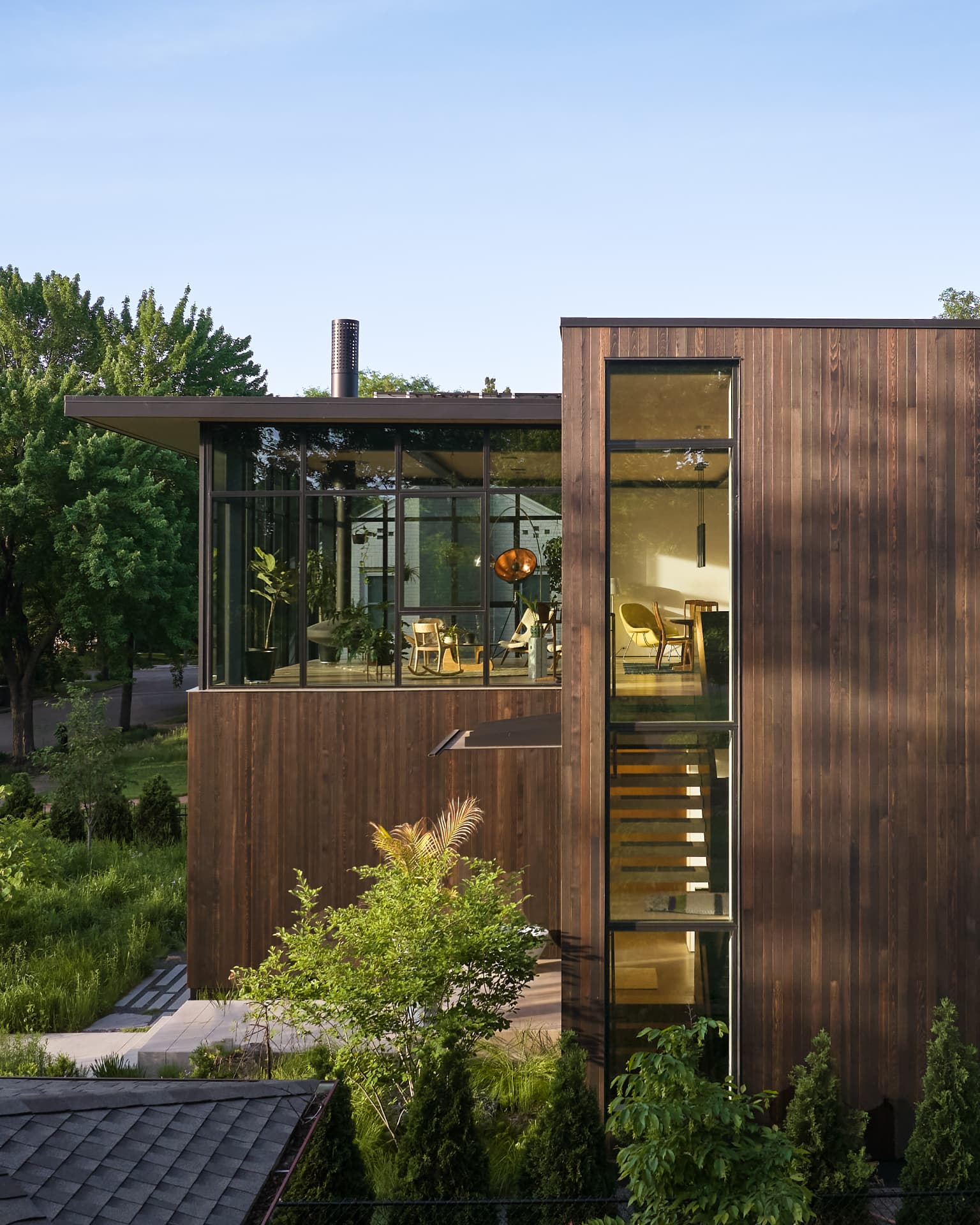 River’s Edge wood-clad facade in evening light