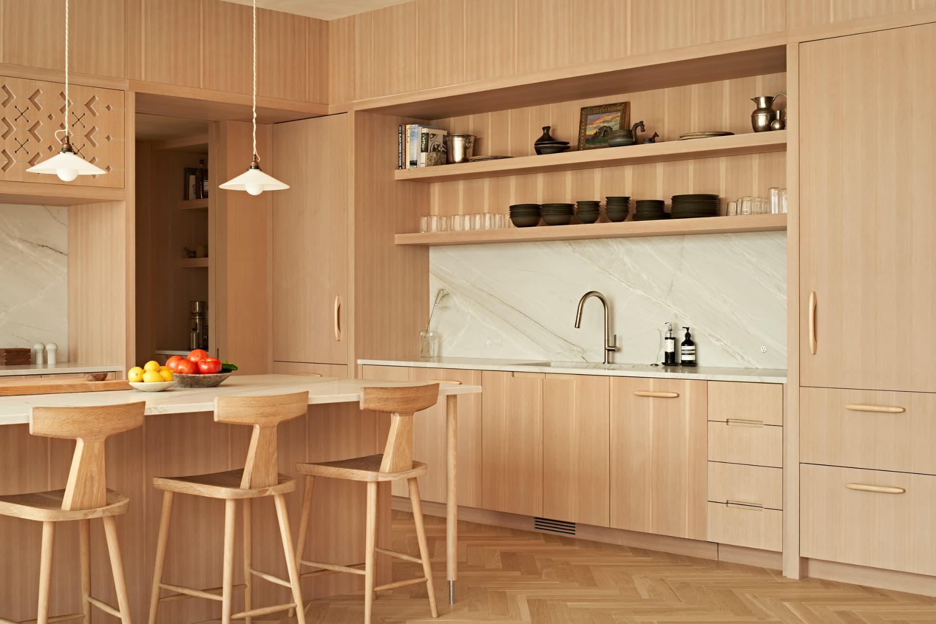 Hill House kitchen angle with marble island and bar stools