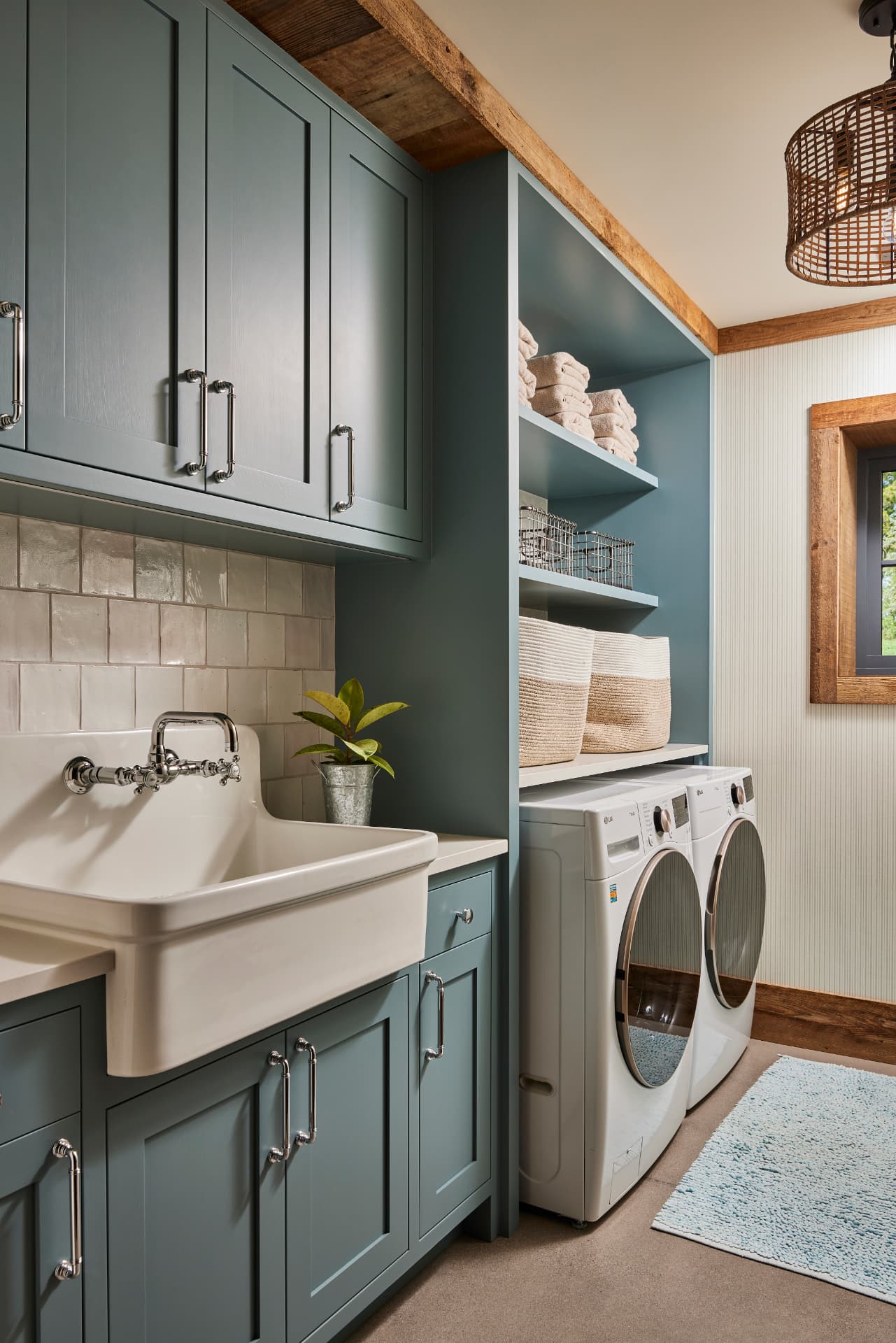 Timber Retreat laundry room with blue cabinets