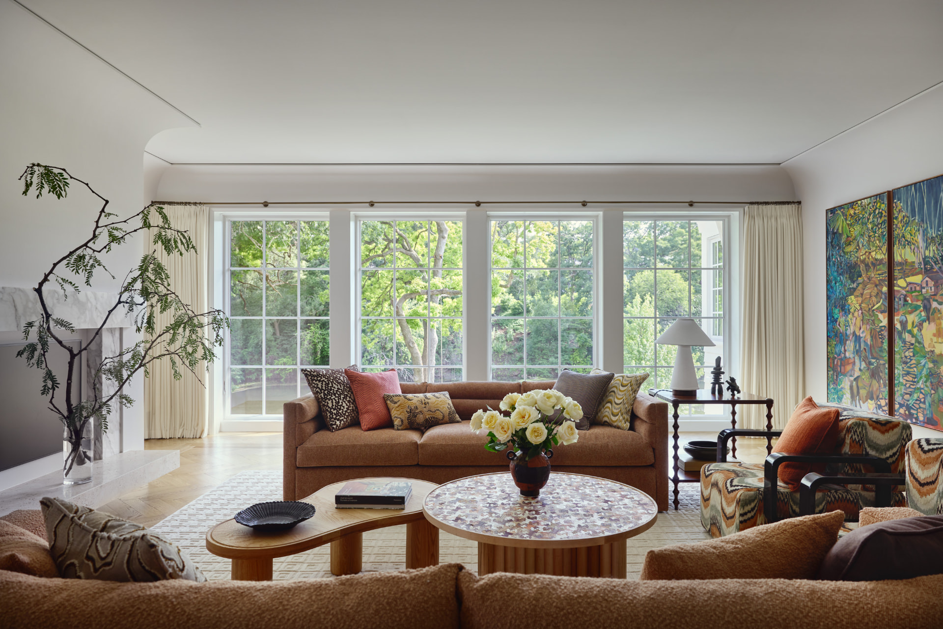 Waters Edge living room overlooking mature trees