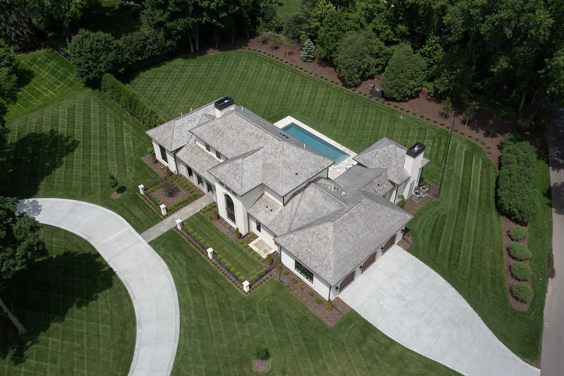 Aerial view of Highcroft with circular drive and manicured lawns