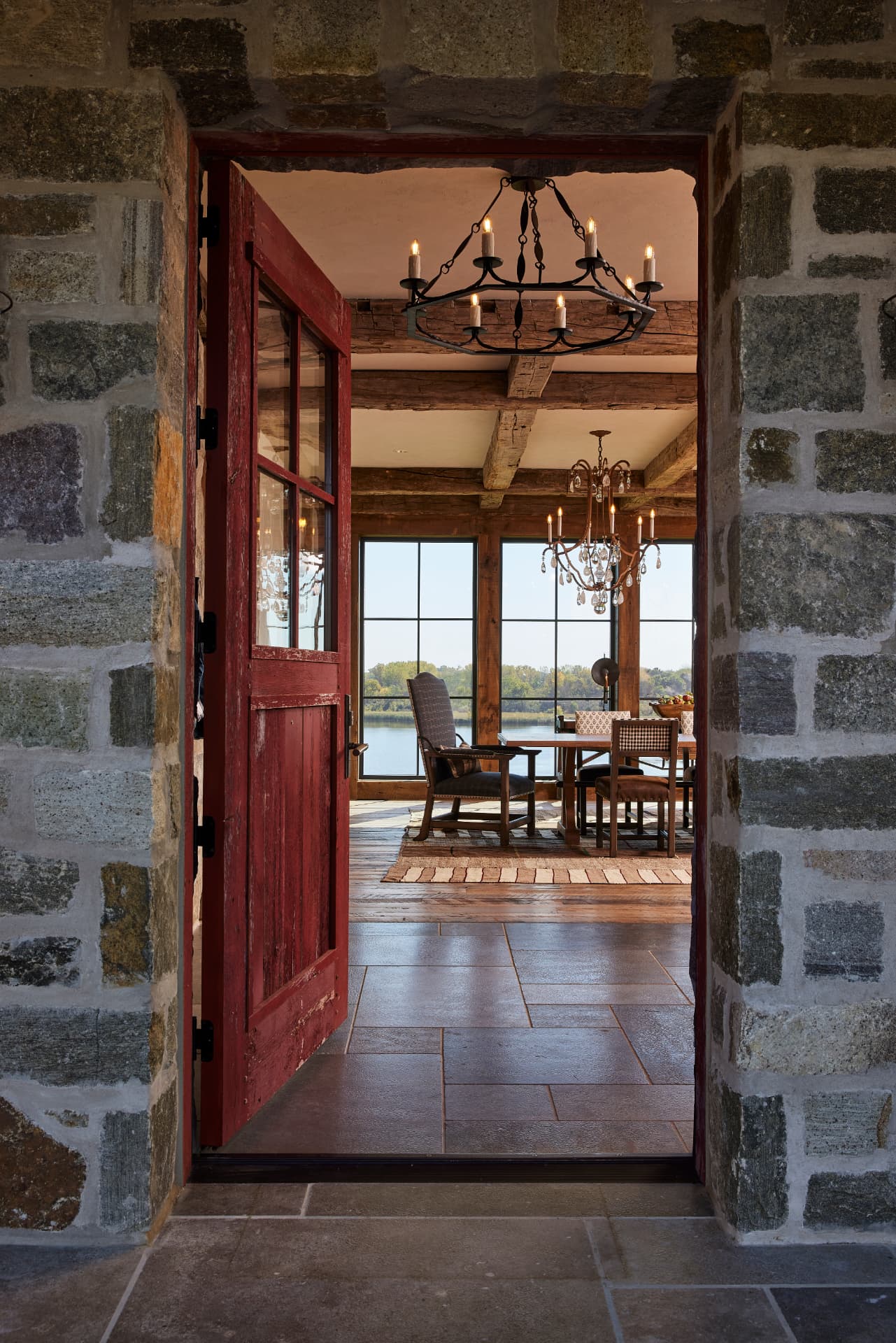Timber Retreat red entry door framing the lake