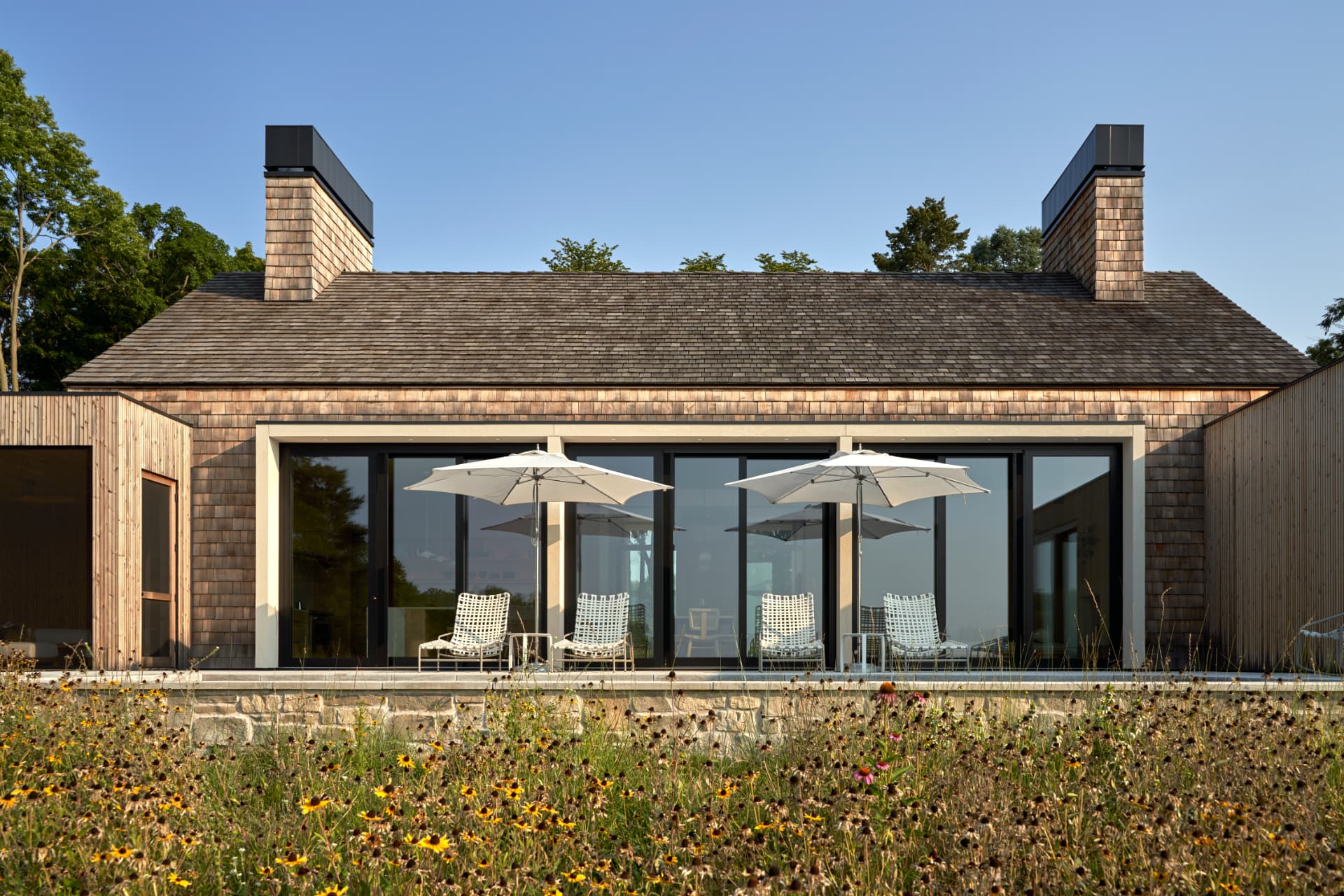 Hill House lake-facing terrace and expansive glazing