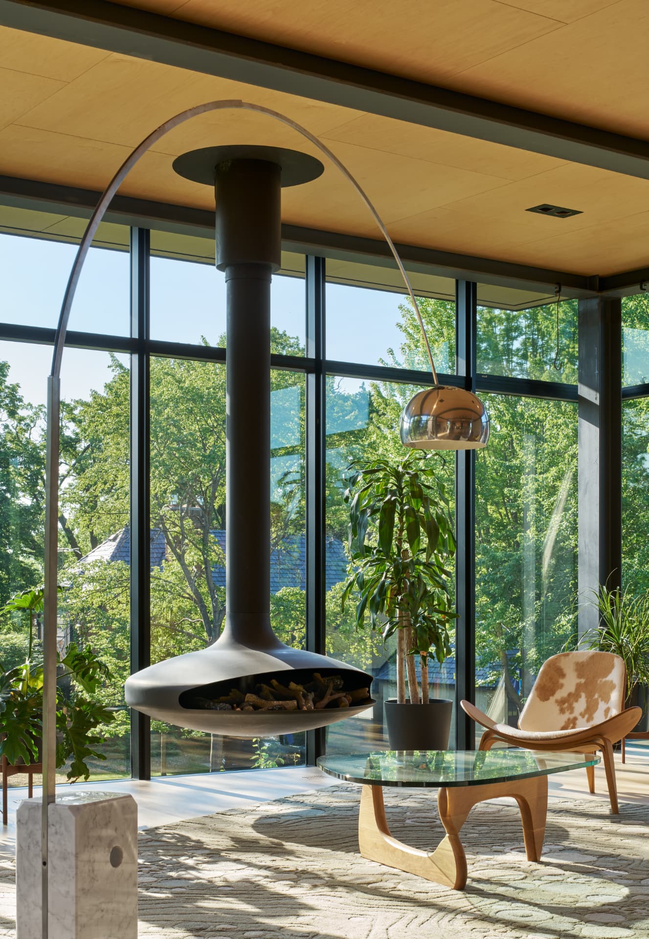 River’s Edge suspended fireplace and sunlit sitting area