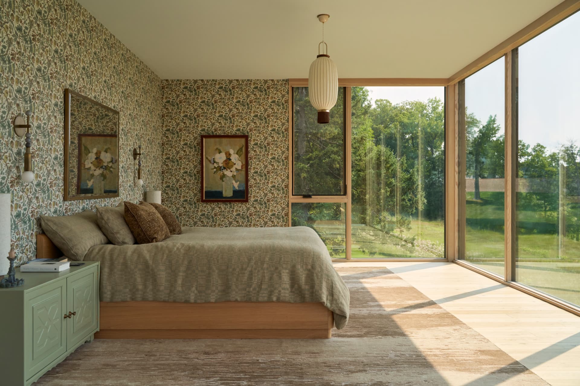 Hill House primary bedroom with patterned wallpaper and lake view