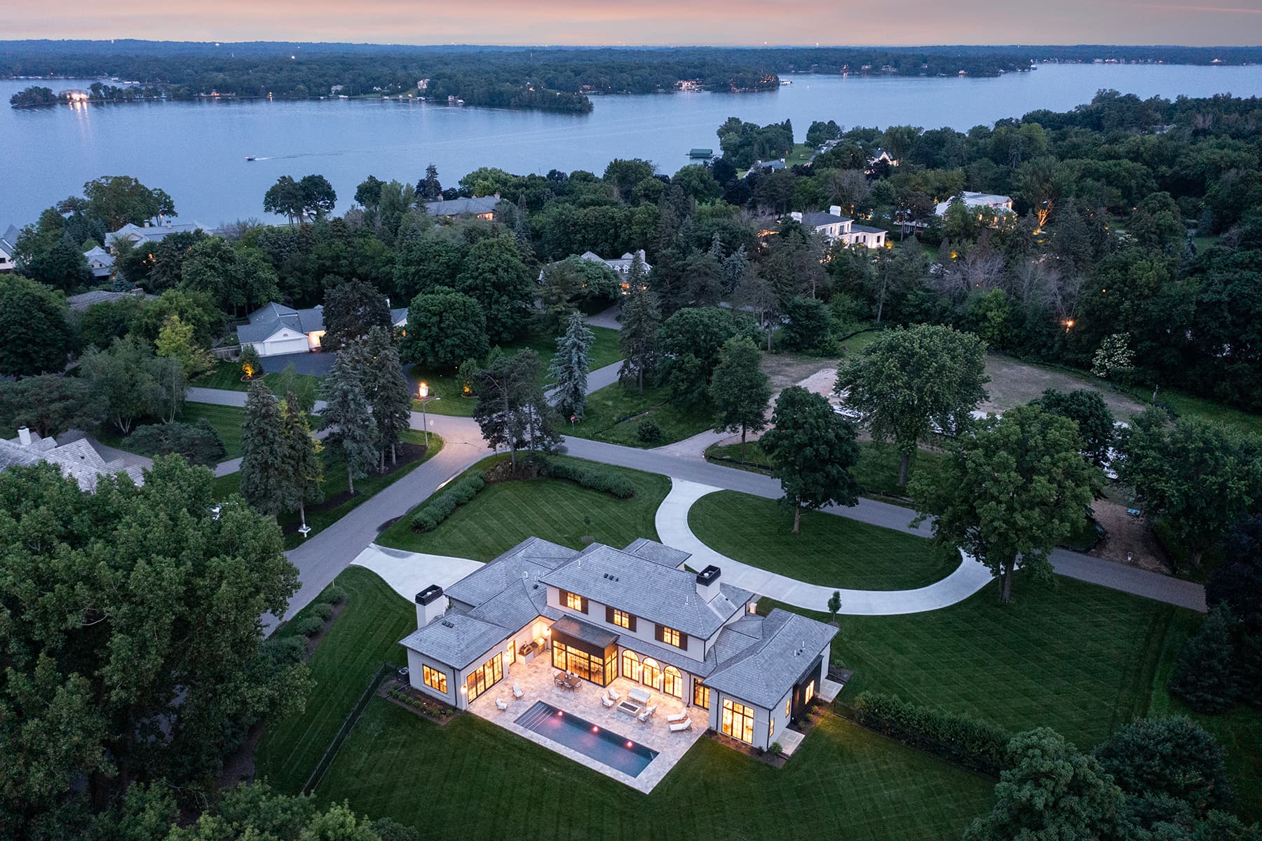 Aerial view of Highcroft with Lake Minnetonka beyond at twilight