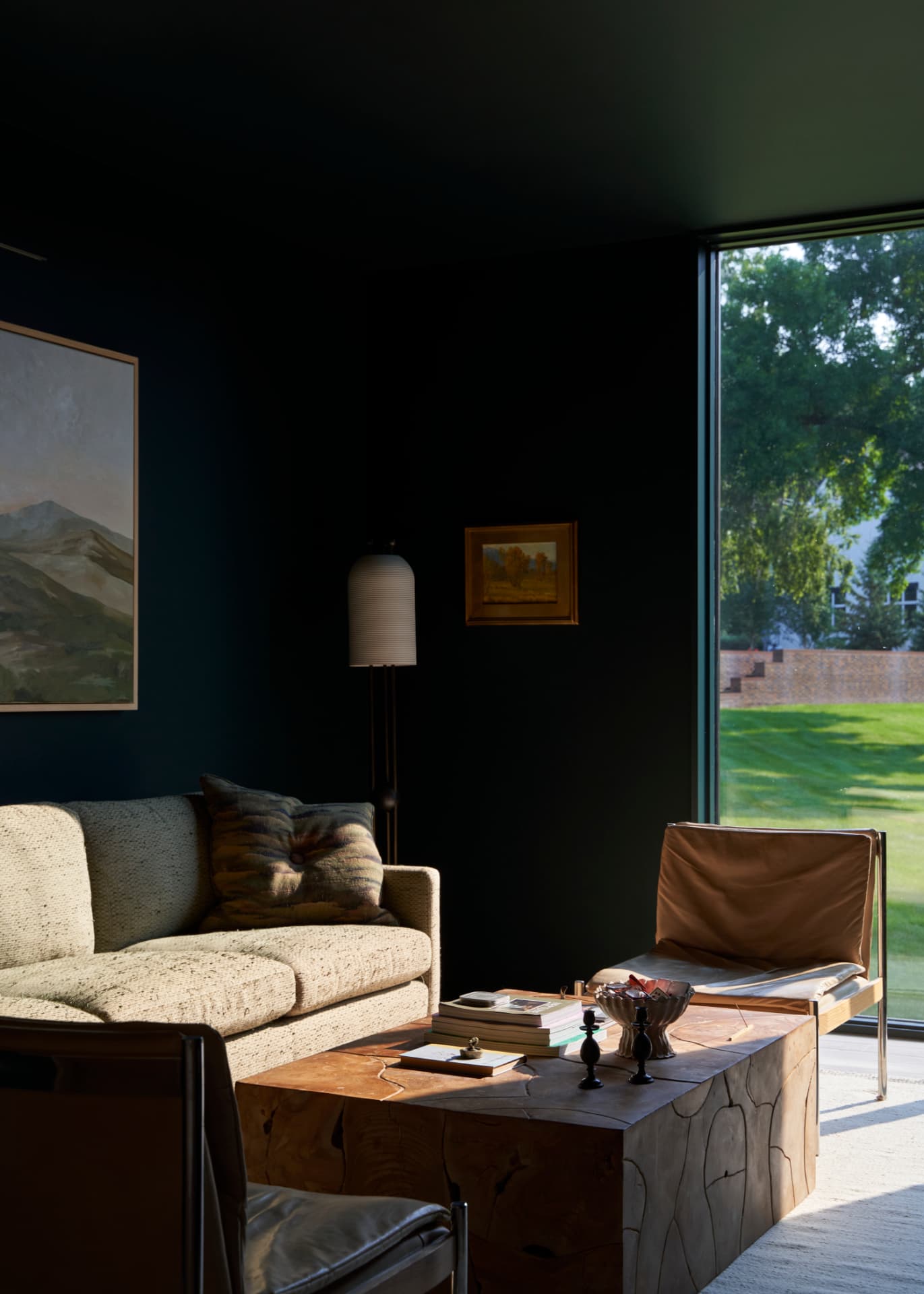 Hill House den seating area with layered textiles