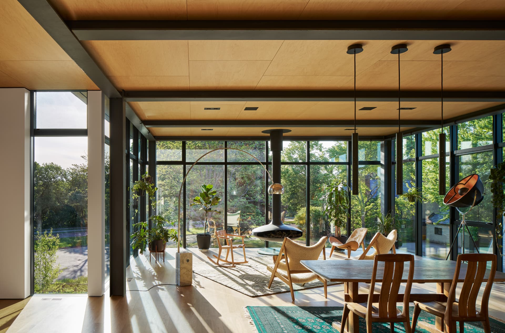 River’s Edge glass-walled living and dining room