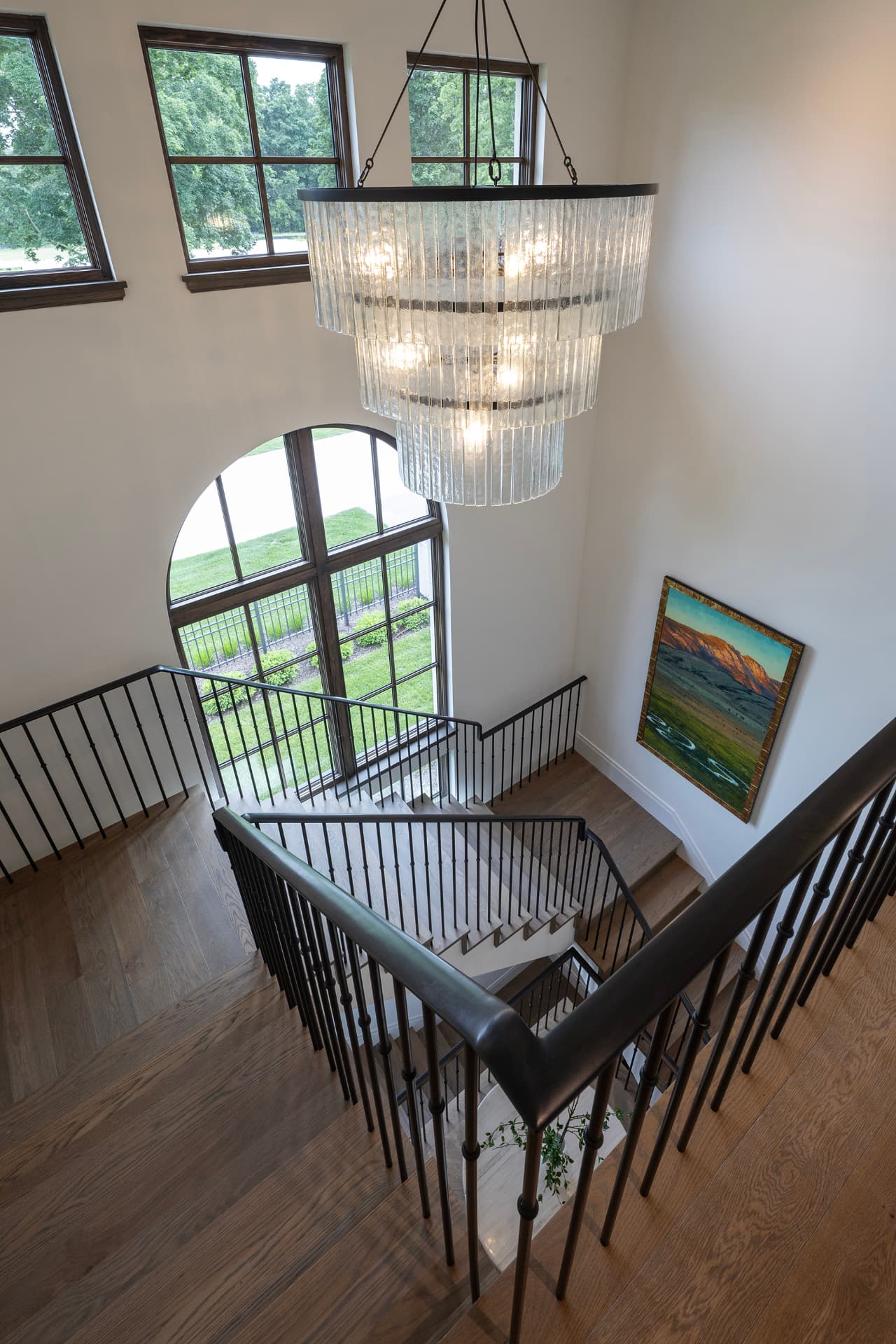 Highcroft stair hall from above with layered glass chandelier