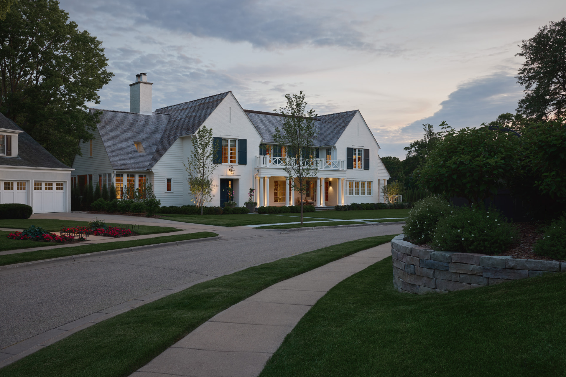 Waters Edge residence illuminated at dusk