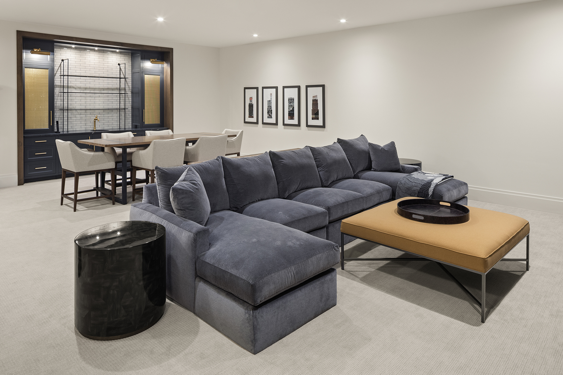 Highcroft lower level lounge with velvet sectional and wet bar