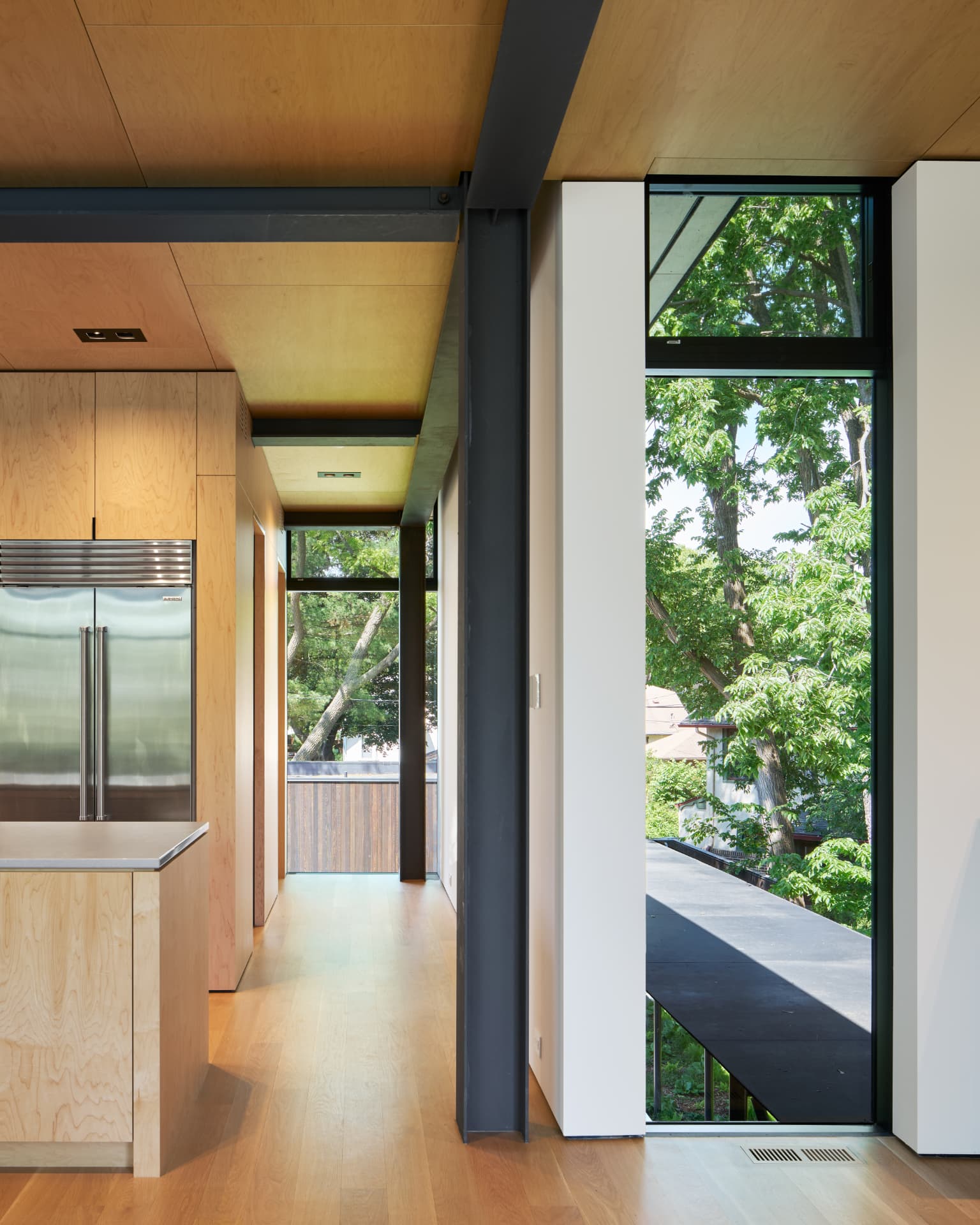 River’s Edge kitchen corridor and tree-framed window