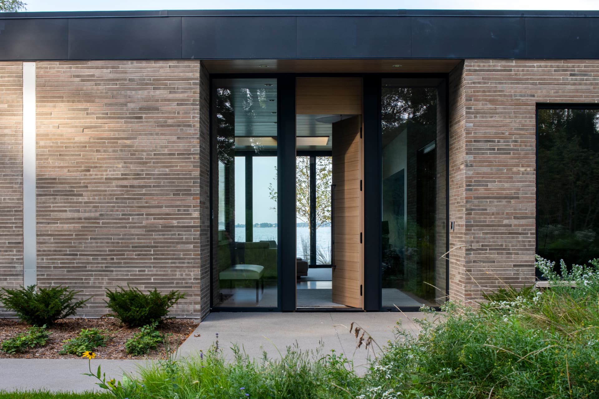 Shoreline Modern entry with lake view