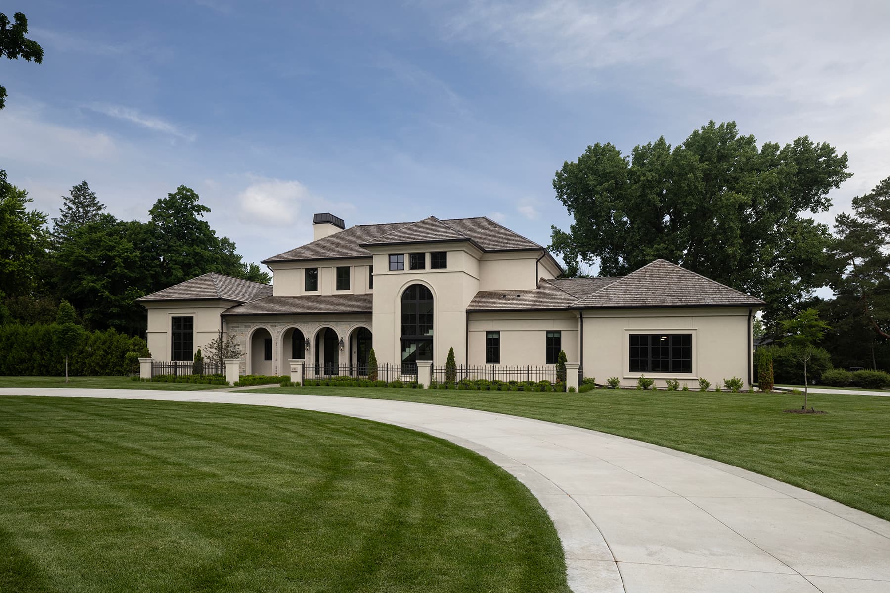 Highcroft front elevation with curved drive and manicured lawn