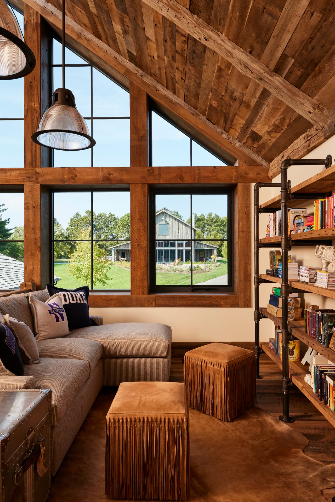 Timber Retreat upper loft lounge with lake view