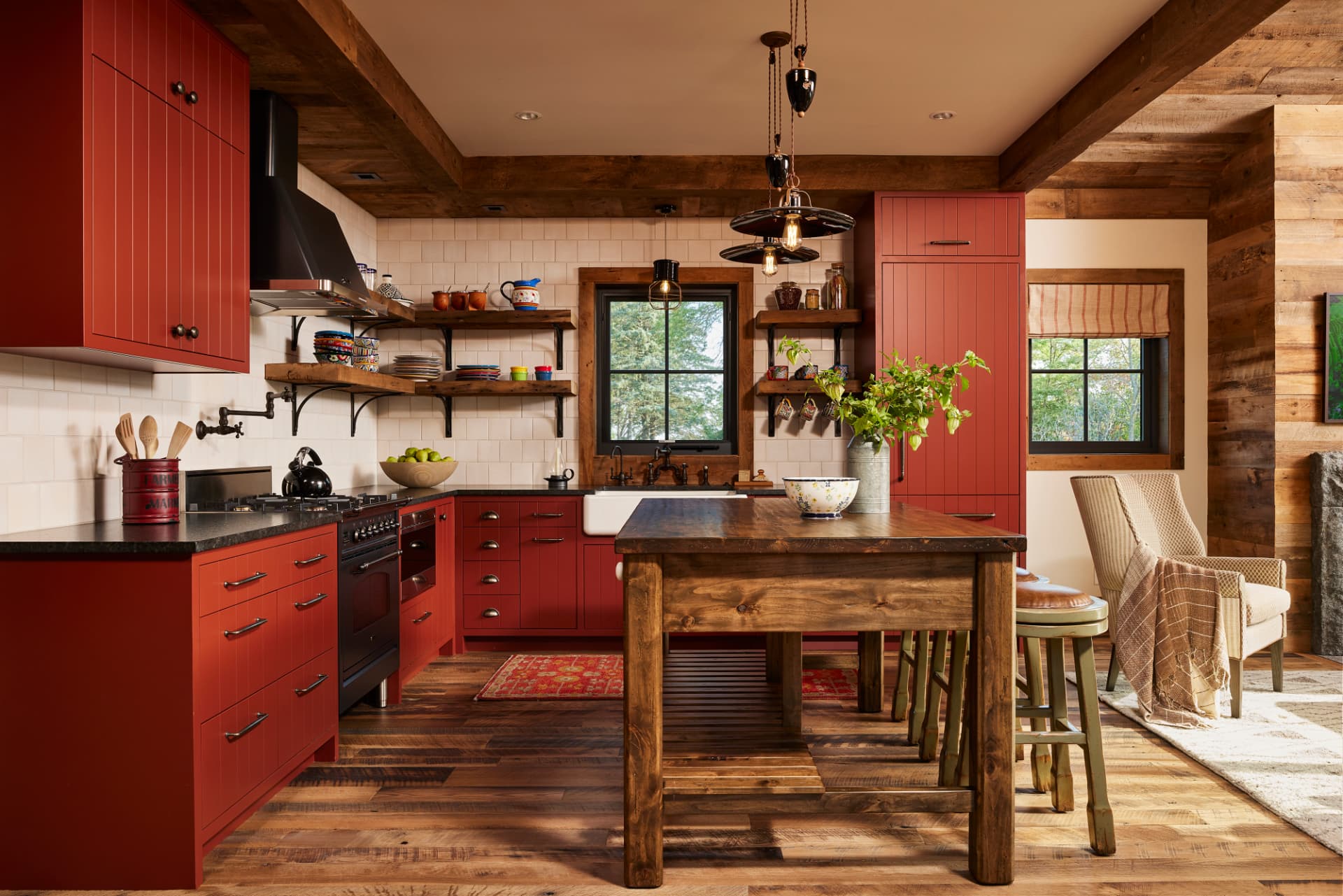 Timber Retreat kitchen with red cabinets and wood beams