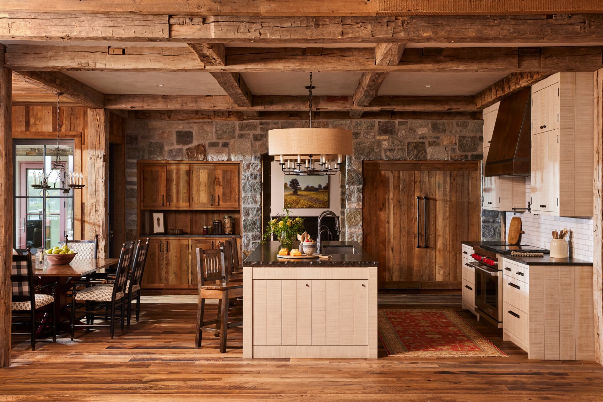 Timber Retreat kitchen with stone wall and center island