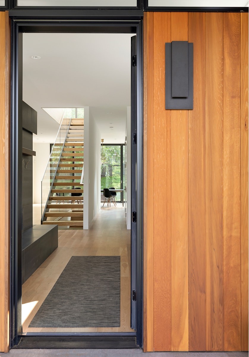 aerial of modern custom home on city lot