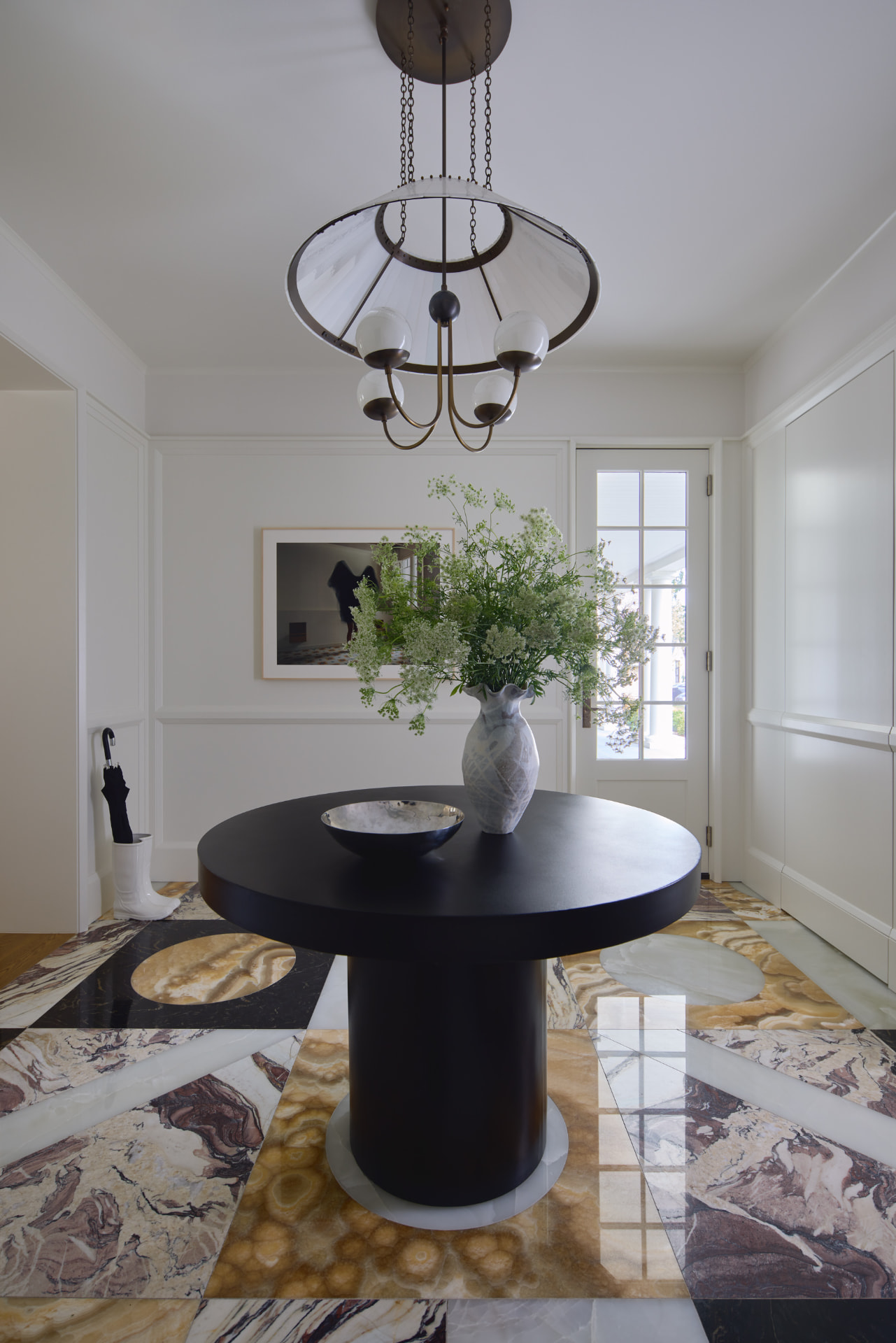 Waters Edge entry hall with patterned stone floor