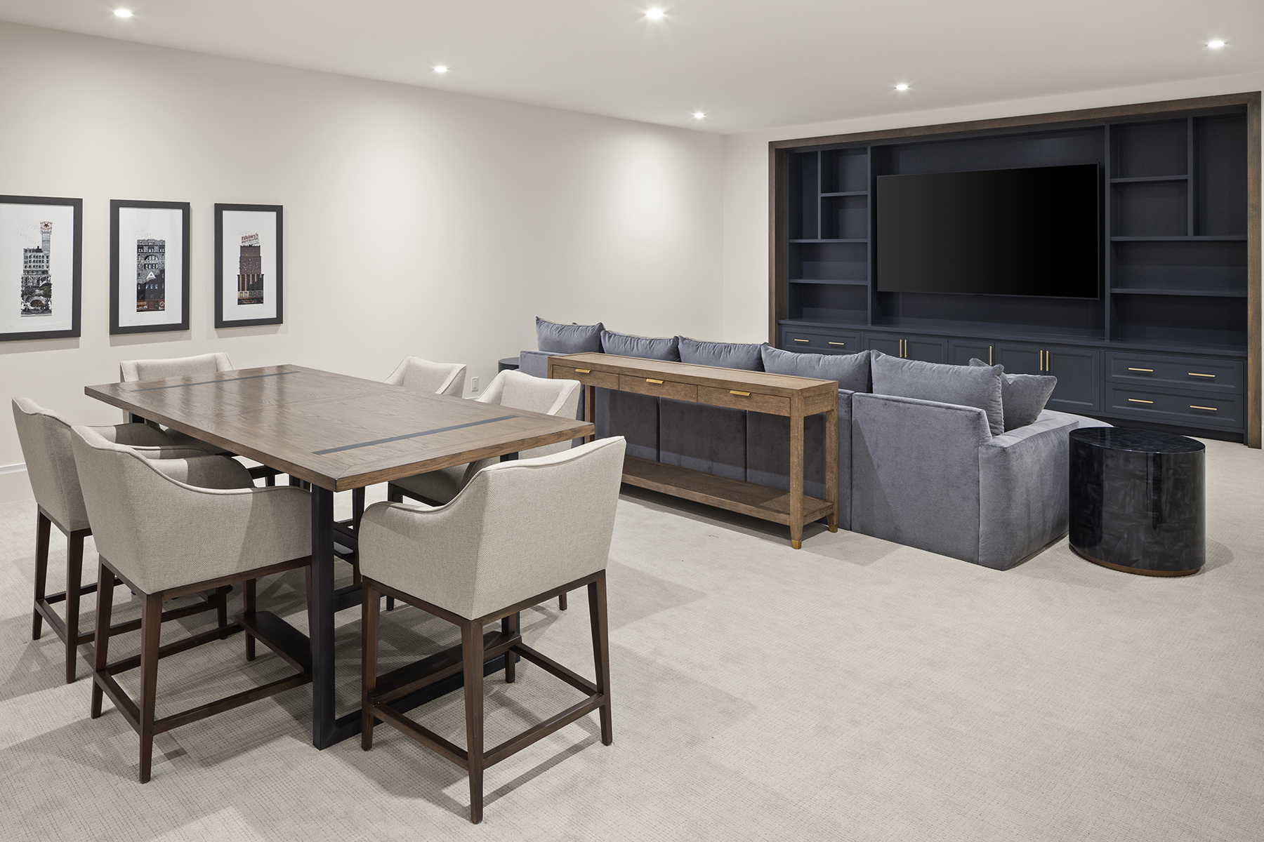 Highcroft lower level game and media room with built-in cabinetry